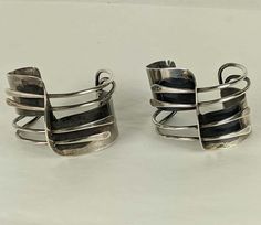 For Sale on 1stDibs - Pair of Iconic Art Smith 'Modernette' Cuffs from the 1940's in sterling silver. Pioneering jeweler Art Smith created some of the most iconic designs in Modernist Polished Cuff Bracelet For Formal Occasions, Contemporary Silver Cuff Jewelry, Modernist Polished Cuff Bracelet, Vintage Collectible Cuff Bracelet With Polished Finish, Modernist Cuff Bracelet With Polished Finish, Adjustable Modernist Cuff Bracelet For Formal Occasions, Modernist Polished Cuff Jewelry, Modernist Polished Silver Cuff Bracelet, Modernist Cuff Jewelry With Polished Finish