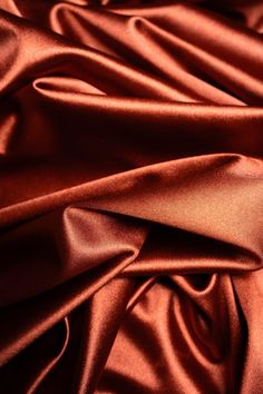 a close up view of an orange satin fabric