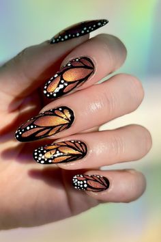 Get ready to embrace nature-inspired elegance with this stunning butterfly nail design! Perfect for any occasion, this manicure brings a soft, whimsical touch to your nails with hand-painted butterflies and delicate accents. Whether you're prepping for a special event or just elevating your everyday look, this butterfly nail art is both trendy and timeless. Try it out for your next nail appointment and watch your style take flight! Tap to save this look and share it with your nail tech! 🦋✨

#ButterflyNails #NailArt #WhimsicalNails #ButterflyManicure #NailDesignInspo Halloween Butterfly Nails, Fall Butterfly Nails, Stiletto Butterfly Nails, Black And Blue Butterfly Nails, Monarch Butterfly Nail Art, Butterfly Nails Natural Nail, Butterfly Nails Design, Butterfly Nails Acrylics, Orange Butterfly Nail Designs