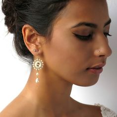 "I created this Pearl wedding earring by hand, using Swarovski Rivoli 10mm for each one, Swarovski 3-5 mm pearls, Swarovski drop pearl, Miyuki round seed beads, Miyuki Delica beads, and 14k goldfilled ear-wire Elegant, feminine and impressive * Measurements: Earring length: 2.36\" (6cm) Pendant diameter: 0.78\" (2cm) * The earrings will come beautifully packaged for a gift. * For other Bridal earrings: https://www.etsy.com/ca/shop/LioraBJewelry?ref=listing-shop2-all-items-count%C2%A7ion_id&s Long Chain Earrings Gold, Earrings Handmade Beaded, Pearl Wedding Jewelry, Pearl Wedding Earrings, Earrings For Bride, Pearl Drop Earrings Bridal, Earrings Pearl Drop, Earring Pearl, Pearl Drop Earrings Gold