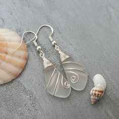 "Aloha! These design shows my love for this beautiful island of Hawaii. This item will be made to order and shipped directly from Hawaii. This is sea glass earrings with silver hooks. This handmade in Hawaii jewelry gift is from cultured sea glass that are specially formed into its shape for jewelry making. Each comes with a gift box with \"handmade by yinahawaii\" stamp and a ribbon wrapped as shown in the 2nd photo, ready to give as gift. I also offer Free gift messaging with the order. Please Beach Earrings In Silver With Recycled Glass, Silver Recycled Glass Earrings For The Beach, Silver Recycled Glass Beach Earrings, Beach Silver Earrings With Recycled Glass, White Sea Glass Jewelry Gift, Silver Sea Glass Earrings For Beach, White Recycled Glass Jewelry For The Beach, Handmade White Sea Glass Jewelry, White Recycled Glass Jewelry Gift