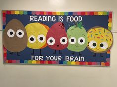 a bulletin board with the words reading is food for your brain and four donuts