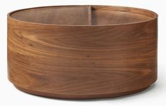 a large wooden bowl sitting on top of a table