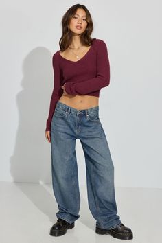 These baggy-fit jeans sit low on the hips and come with a bigger, full-length leg that bunches at the bottom. Perfect for your biggest sweater or your tiniest shirt. We're so in our bag rn. Features - Five-pocket styling - Zip-fly with button closure Size & Fit - Fit: Relaxed - Rise: 11.5" - Inseam: 32" - Model is wearing size 3 Materials & Care - Content: 75% cotton, 25% organic cotton - Care: Wash cold, inside out - Imported Low Rise Flare Jeans Outfit, Tiny Shirts, Low Waisted Pants, Flare Jeans Outfit, Low Rise Baggy Jeans, Low Waist Jeans, Big Sweaters, Oversized Jeans, Gaming Clothes