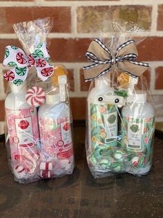 two bottles filled with candy and wrapped in cellophane