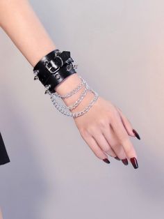 Elevate your cyberpunk style with our gothic black studs cyberpunk PU wristband bracelet with chains. Made from high-quality PU leather, this wristband features edgy studs and chains that add a bold statement to your outfit. The black color provides a dark, mysterious vibe, perfect for expressing your unique fashion sense.   Please note that this product includes only one bracelet.  Garment Size   	 		 			Size 			Free Size 		 		 			Adjustable Circumference 			20-23 		 		 			Width 			5 Metal Punk Style Chain Bracelet, Black Punk Bracelets For Festival, Black Punk Festival Bracelets, Adjustable Metal Punk Chain Bracelet, Black Leather Punk Bracelet With Wrist Strap, Edgy Black Bracelet With Wrist Strap, Adjustable Metal Chain Bracelet, Punk Style, Black Rock Style Jewelry For Streetwear, Rock Style Black Jewelry For Streetwear