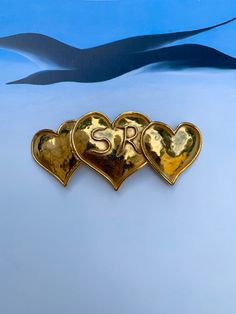 Vintage large three hearts brooch by Sonya Rykiel Paris - Iconic designer - measures 4 inches across and 1.9 inches wide - in most incredibly buttery gold finish with initials SR. A rare vintage find in pristine condition - thank you for coming to my store - I ship fast Three Hearts, Gold Brooch, Heart Brooch, Gold Brooches, Vintage Finds, Gold Finish, Icon Design, Brooches, Initials