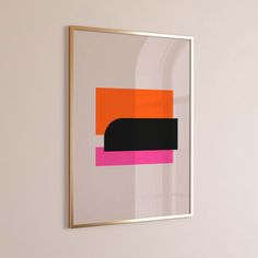 an orange and pink abstract painting hangs on the wall next to a white vase with a plant in it