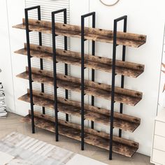 a book shelf made out of wooden planks in a room with a rug on the floor