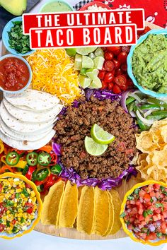 the ultimate taco board is loaded with many different toppings and condiments