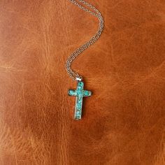 Express your faith with this dainty, beautiful necklace. Our GENUINE STONE CROSS NECKLACE is simple, yet powerful. Designed with one-of-a-kind durable 316L Stainless Steel crushed Turquoise. Perfect for everyday wear and other special occasions. ABOUT THIS PRODUCT Material: 316L Stainless Steel Stone Options: Genuine TurquoiseColor*/Finish: Silver Size: 16” Chain + 2" Extender Pendant Size: 1.22 inches x 0.67 inches Girlfriend Friendship, Western Fits, Stone Cross, Stainless Steel Cross Pendant, Antler Ring, Cross Necklaces, Steel Cross, Engagement Sets, Sparkly Things