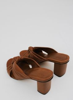 The mule version of our beloved Teresa Sandals. Crafted with meticulous attention to detail, these mules are designed to feel like you're walking on clouds. The Teresa mules have cushioned soles that provide unparalleled support and comfort for all-day wear. Featuring a beautifully crafted leather knot, these mules effortlessly elevate any outfit, adding a touch of sophistication to your look. DETAILS 100% LeatherHandmade in Mexico3.5 inch heel On Clouds, Walking On Clouds, 5 Inch Heels, Effortless Chic, Spending Money, Everyday Wardrobe, Small Leather Goods, Fast Fashion, Leather Accessories