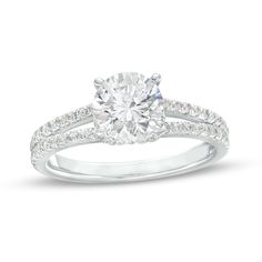 a white gold engagement ring with diamonds on it