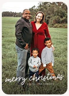 a happy holiday card with an image of two adults and three children in a field