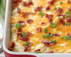 a casserole dish with bacon and green onions