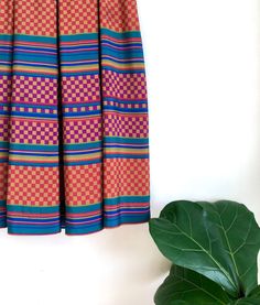 Gorgeous retro vintage checkered rainbow skirt with a 90s vibe - multicolored with pleat detail...by Liz Claiborne. Button closure. Tag size 4. Waist: 13.5" across  Length: 30" Great vintage condition, light age wear. #retro #80s #90s #rainbow #checkered Rainbow Checkered, Forest Vintage, Geometric Rainbow, Rainbow Skirt, Vintage Rainbow, Liz Claiborne, Labour Day, Midi Skirt, Retro Vintage