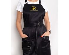 Stylish beauty master apron made from waterproof fabric.  This apron is suitable for hair stylists, make up artists, nail masters, PMU  and lash masters, florists. It is made from quality fabric, composition - 50% polyester, 50% cotton, with waterproof layer. We use stainless steel gold color metal details that can be washed and do not change color. This apron can be personalized with embroidery. It is free of charge. You can choose from our embroidery templates or we can embroider your logo, na Esthetician Apron, Nail Apron, Hair Stylist Apron, Salon Apron, Hairstylist Apron, Nail Stylist, Salon Aprons, Stylists Aprons, Barber Apron