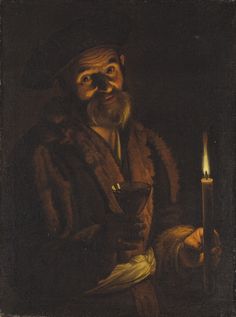 an old man with a candle in his hand