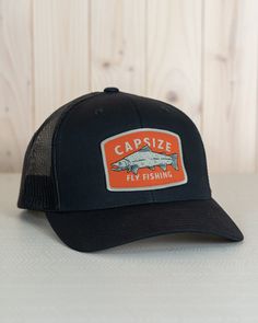 The Fly Fishing Trucker Hat has a classic medium crown profile and a mesh back with a Snapback closure. It has a Capsize Fly Fishing wild salmon Embroidered Patch on the front. Structured Black Trucker Hat Embroidered Patch Mesh back Pre Bent Bill Mid Profile Six panel with Snapback Closure One size fits all Black Trucker Hat, Wild Salmon, Fishing Hat, The Fly, Embroidered Patch, Fly Fishing, Embroidered Patches, Trucker Cap, One Size Fits All