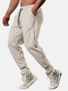 Elevate your athleisure game with our Cropped Joggers With Drawstrings. Crafted from premium polyester, these joggers provide a soft feel for all-day comfort. The cropped design adds a modern twist to your outfit, while the drawstring waist allows you to adjust the fit to your preference. Whether you're running errands or going for a jog, these joggers offer the perfect combination of style and functionality. Specifications: Material: Polyester Package included: 1*Pants Size Chart (inches): Size Sporty Streetwear Joggers With Drawstring, Sporty Joggers With Drawstring For Streetwear, Streetwear Athleisure Joggers With Drawstring, Athleisure Joggers With Drawstring For Streetwear, Sportswear Pants With Drawstring For Jogging, Sportswear Jogging Pants With Drawstring, Solid Color Drawstring Sweatpants For Jogging, Gray Stretch Joggers With Drawstring, Drawstring Joggers For Streetwear