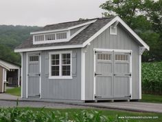 two garages side by side with one door open