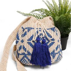 Tribal Straw Crossbody Bucket Bag 211-2 (1 unit) Bohemian Natural Backpack, Natural Bohemian Backpack, Bohemian Bucket Straw Bag For Travel, Woven Vacation Backpack, Bohemian Pouch Bucket Bag For The Beach, Bohemian Beach Bucket Bag In Pouch Shape, Bohemian Beach Bucket Bag Pouch, Adjustable Woven Shoulder Bag For Travel, Casual Woven Bags For Festival