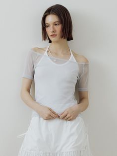 This is a minimal and feminine top by Lucirzu that is made out of high quality and sturdy material. With distinctive mood of the design and comfortable wear, you can use it for your daily lifestyle.- Trendy layered detail- Off shoulder t-shirt and halter sleeveless top set up- Silver logo embellishment detail- Modern and minimal mood Versatile White Everyday Crop Top, Versatile White Crop Top For Everyday, Modern White Tops For Layering, Casual White Tops With Minimal Stretch, Modern White Crop Top For Spring, Modern Stretch Blouse For Summer, Versatile White Tops For Everyday Wear, Chic T-shirt For Spring Layering, Modern White Spring Crop Top