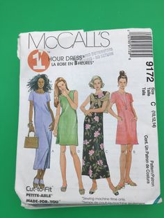 three women's dresses in different styles on a green surface with the words mocais written below them