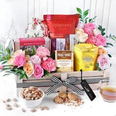 a basket filled with lots of different types of food and snacks on top of a table