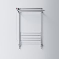 a white towel rack hanging on the side of a wall