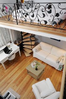 an overhead view of a living room and staircase