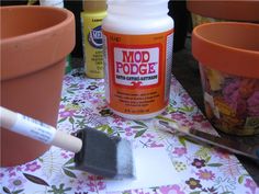 the paint is being used to make flower pots