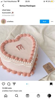 a heart shaped cake with the letter m on it's side is displayed in an instagram