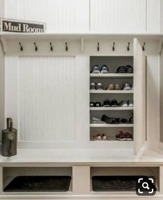 the mud room is clean and ready to be used as a shoe storage area for shoes