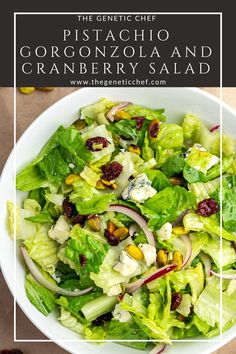 a white bowl filled with lettuce and cranberry salad