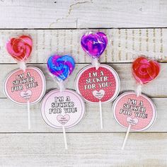 four lollipops with i'm a sucker for you stickers