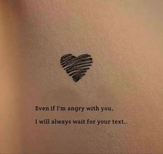 a heart drawn on the side of a wall with words written below it that says, even if i'm angry with you, i will always wait for your text