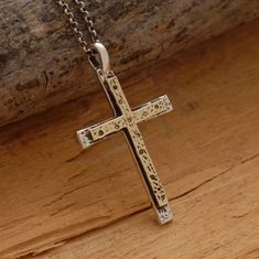 Share the spirit of faith with someone you hold dear. This 14 karat gold and sterling silver double cross necklace is a fitting gift for someone special on your gift list. It features two crosses, one made of sterling silver and one made of 14 karat gold, that have been hand-designed and melded together in a harmony of design. Suspended from a sterling silver chain or black leather cord with silver clasp and endings, makes a gorgeous accessory that can be worn every day or reserved for those spe Sterling Silver Cross Necklace For Wedding, Gold Sterling Silver Cross Necklace For Anniversary, Spiritual Crucifix Cross Necklace For Anniversary, Sterling Silver Cross For Anniversary, Engraved White Gold Cross Necklace As Gift, Engraved White Gold Cross Necklace Gift, Sterling Silver Cross Jewelry For Anniversary, White Gold Cross Charms For Anniversary, Engraved Cross Necklace For Anniversary