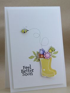 a handmade card with a rubber boot and flowers on it that says, feel better soon