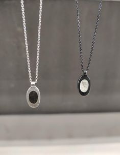 Discover the unique elegance of the flat oblong oval pendant in sterling silver and with a rough finish beautifully crafted with gray and white concrete inlay.  This modern piece offers a striking contrast between the industrial look of concrete materials and the timeless shine of silver.  The pendant hangs on a sterling silver chain with a handmade hook clasp. Available in oxidized finish and white concrete and in silver with gray concrete. Minimalist, contemporary design perfect for everyday w Silver Necklace With Oval Pendant, Modern Sterling Silver Oval Pendant Jewelry, Minimalist Sterling Silver Oval Pendant Jewelry, Minimalist Oval Link Necklace With Polished Finish, Minimalist Silver Oval Necklace, Minimalist Sterling Silver Oval Pendant Necklace, Modern Silver Oval Pendant Jewelry, Silver Oval Necklace For Everyday, Everyday Silver Oval Necklace