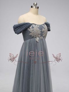 This elegant Gray Regency Bridgerton Empire Waist Lace Formal Dress is a must-have staple for your formal wardrobe. Crafted from a luxurious lace and tulle fabric, this dress has a classic 1920s Empire style silhouette that is perfect for your next Bridgerton ball, regency-themed event or grand wedding. With timeless style and endless elegance, you'll look like a true Bridgerton! Silhouette: Empire Style: Elegant Primary Fabric: Lace and Tulle Neckline: Off the Shoulder Closure: Corset Back Made Violet Bridgerton Dress, Elegant Tulle Lace Dress For Prom, Regency Inspired Dress, Elegant Lace Evening Dress With Tulle Skirt, Elegant Tulle Dress With Lace Patchwork, Elegant Lace Dress With Tulle Skirt, Elegant Tulle Lace Dress For Prom Season, Formal Gown With Lace Sleeves And Tulle, Evening Lace Dress With Fitted Bodice In Tulle