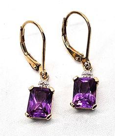 Pink Sapphire faceted open work gold over sterling silver vermeil earrings. Good used condition with little to no signs of normal vintage wear. Prong set emerald cut pink sapphire earrings. Stamped on the back 925 with a wave hallmark and China. Acid tests positive for sterling silver. Gemstone tested with Presidium II gemstone tester. Glows under UV light. Earrings measure 1 inch tall and 1/4 of an inch wide. Classic Octagon Gemstone Earrings, Sterling Silver Octagon Jewelry With Matching Earrings, Elegant Octagon Gemstone Earrings, Octagon Gold Earrings In Fine Jewelry Style, Fine Jewelry Gold Octagon Earrings, Gold Octagonal Earrings In Fine Jewelry Style, Octagon Gemstone Earrings For Anniversary, Gold Octagon Earrings Fine Jewelry, Costume Jewelry Cubic Zirconia Earrings As Gift