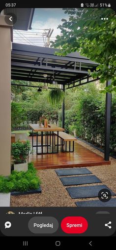 an outdoor patio with wooden floors and plants on the ground, in front of a gazebo