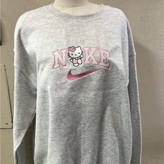 Nike Hello Kitty Crew Neck Sz L Embroidered Nike Hello Kitty Sweater, Hello Kitty Nike Sweatshirt, Hello Kitty Wardrobe, Hello Kitty Fit, Hello Kitty Sweater, Sweaters Nike, Outfits To Buy, Nike Hoodies For Women, Sanrio Clothes