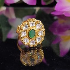 Classy and detailed Designer White Colored Kundan Gold Plated Ring. This is stylish and adjustable. This ring will work well with traditional, formal, and western formals. Eye-catching and unique jewelry that will set you apart. Gift this piece to a loved one, and see their face light up with joy. Best for gifting or for personal use, wear it to any occasion and become the spotlight. Traditional Adjustable Rings For Festive Occasions, Traditional Adjustable Toe Rings For Wedding, Traditional Green Toe Ring, Adjustable Elegant Ring For Festive Occasions, Elegant Adjustable Rings For Festive Occasions, Western Formals, Beaded Ring, Emerald Bead, Face Light