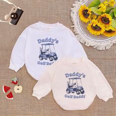 Daddy's Golf Buddy Golf Cart Father Golfing Boys T-Shirt Baby Romper ,Golfing Buddy , Cute Romper Sweatshirt , Baby Announcement - Handmade  - Ships from USA  - Materials: 100% CPSIA Compliant and Ethically Made material Light fabric (5.0 oz/yd² (170 g/m  Crafted with soft, breathable fabric, this romper ensures your baby stays comfortable through playtimes and nap times alike. Featuring charming designs suitable for all babies, our romper is as adorable as it is practical.  Quick Sizing Tip  Ou White Cartoon Print Tops For Sports, White Crew Neck Top For Golf, White Golf Top With Letter Print, White Crew Neck Golf Top, White Cartoon Print Sports Top, White Golf Tops With Letter Print, White Long Sleeve Golf Tops, White Letter Print Golf Tops, White Long Sleeve Top With Name Print