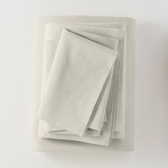 white sheets folded on top of each other