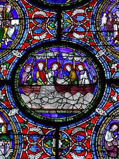 an image of a stained glass window with people in boats on the water and other things around it