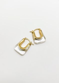 Our classic Christy earrings feature a rectangle shape and transparent gold finish. Perfect for everyday wear, these earrings are both stylish and sophisticated. - Hypoallergenic - 14K Gold Plated over Sterling Silver - Weight: 12 grams Shipping: Ready to Ship Modern Earrings With Rectangular Stone For Gift, Modern Earrings With Rectangular Stone Gift, Modern Rectangular Stone Earrings For Gifting, Gold Rectangular Everyday Earrings, Gold Rectangular Earrings For Everyday, Classic Square Hoop Earrings As Gift, Yellow Gold Oblong Earrings For Everyday, Oblong Everyday Earrings For Pierced Ears, Elegant Oblong Earrings For Pierced Ears