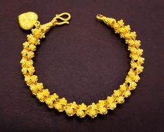 Yellow Gold Plated Bracelets For Wedding, Yellow Gold-plated Bracelets For Wedding, Gold Flower Bracelets For Wedding, Elegant Yellow Flower Bracelets, Elegant Yellow Flower Bracelet, Gold Floral Jewelry For Festivals, Yellow Gold Flower Bracelets For Wedding, Yellow Jubilee Bracelet Jewelry For Wedding, Gold Wedding Jewelry